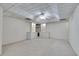 Bright basement space featuring custom built-in shelving and ample carpeting at 775 Hales Trace Sw Way, Lilburn, GA 30047