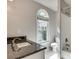 Bathroom featuring a granite countertop and a tiled shower/tub combo at 775 Hales Trace Sw Way, Lilburn, GA 30047