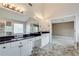 Bathroom featuring double sinks, tile floors, and view into main bedroom at 775 Hales Trace Sw Way, Lilburn, GA 30047