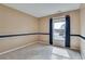 Empty bedroom features neutral paint, a dark accent stripe and carpeted floors at 775 Hales Trace Sw Way, Lilburn, GA 30047