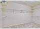 Walk-in closet with carpet and multiple levels of wire shelving at 775 Hales Trace Sw Way, Lilburn, GA 30047