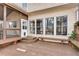 Outdoor deck area with multiple benches and access to the screened porch at 775 Hales Trace Sw Way, Lilburn, GA 30047