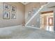 Spacious foyer leading to a carpeted living room, high ceilings, and natural light at 775 Hales Trace Sw Way, Lilburn, GA 30047