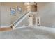 Bright foyer featuring a staircase and access to an open kitchen at 775 Hales Trace Sw Way, Lilburn, GA 30047