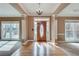 Spacious foyer showcasing hardwood floors, natural light and classic design at 775 Hales Trace Sw Way, Lilburn, GA 30047