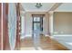 Bright foyer featuring hardwood floors, fresh paint and view to rear living spaces at 775 Hales Trace Sw Way, Lilburn, GA 30047