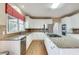 Modern kitchen featuring stainless steel appliances, granite countertops, and ample cabinet space at 775 Hales Trace Sw Way, Lilburn, GA 30047