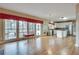 Spacious living room with hardwood floors adjoins the kitchen and provides deck access at 775 Hales Trace Sw Way, Lilburn, GA 30047