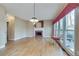 Spacious living room features hardwood floors, fireplace, and large windows at 775 Hales Trace Sw Way, Lilburn, GA 30047