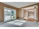 Comfortable carpeted room showcasing ample natural light and an open layout at 775 Hales Trace Sw Way, Lilburn, GA 30047