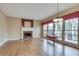 Living room with hardwood floors features fireplace, large windows and plenty of space at 775 Hales Trace Sw Way, Lilburn, GA 30047
