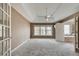 Spacious main bedroom with carpet, ceiling fan, and window offering ample natural light at 775 Hales Trace Sw Way, Lilburn, GA 30047