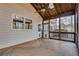 Screened-in porch with ceiling fan and wood flooring and paneling at 775 Hales Trace Sw Way, Lilburn, GA 30047