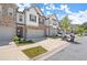 Charming brick and siding townhomes with attached garages and well-maintained landscaping create inviting curb appeal at 1409 Ben Park Way, Grayson, GA 30017