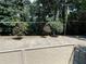 Private backyard featuring tall trees and some vegetation at 5400 Roswell Rd # K1, Atlanta, GA 30342