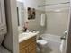 Bright bathroom featuring a shower-tub combo, single sink vanity, and neutral tiling at 5400 Roswell Rd # K1, Atlanta, GA 30342