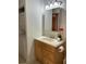 A well-lit bathroom with a modern sink, mirror and in unit laundry at 5400 Roswell Rd # K1, Atlanta, GA 30342