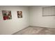 This bedroom features neutral walls, carpet flooring, and a bright window at 5400 Roswell Rd # K1, Atlanta, GA 30342