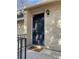 Home exterior showcasing a black front door, brick facade, and decorative light fixture at 5400 Roswell Rd # K1, Atlanta, GA 30342