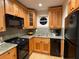 Bright kitchen features wood cabinetry, granite countertops, and modern appliances at 5400 Roswell Rd # K1, Atlanta, GA 30342