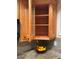 Kitchen cabinet featuring wooden door with glass insert, wooden shelves, and granite countertops at 5400 Roswell Rd # K1, Atlanta, GA 30342