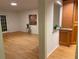 Bright living room and adjoining kitchen with wood floors and french doors leading to the outdoors at 5400 Roswell Rd # K1, Atlanta, GA 30342