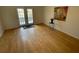 The bright living room has French doors and hardwood floors at 5400 Roswell Rd # K1, Atlanta, GA 30342