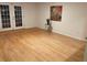 Bright living room with wood floors and french doors leading to the outdoors at 5400 Roswell Rd # K1, Atlanta, GA 30342