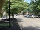 Ample parking available in the well-maintained parking lot surrounded by mature trees at 5400 Roswell Rd # K1, Atlanta, GA 30342