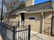 Pool house with brick exterior, signage indicating no lifeguard on duty, and black gated fence at 5400 Roswell Rd # K1, Atlanta, GA 30342