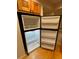 Spacious refrigerator with wire shelves provides ample cold storage at 5400 Roswell Rd # K1, Atlanta, GA 30342