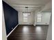 Bright dining room boasts hardwood floors, modern lighting, and neutral paint at 1390 White Oak St Se, Conyers, GA 30013