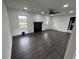 Cozy living room with dark wood floors, a modern fireplace and an abundance of natural light at 1390 White Oak St Se, Conyers, GA 30013