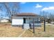 Exterior view of a cozy home featuring a well-maintained yard and inviting front porch steps at 1820 Spring St, Conyers, GA 30012