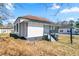 Charming exterior elevation of a quaint single-story home featuring a landscaped yard and inviting front porch at 1820 Spring St, Conyers, GA 30012