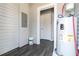 Hallway features gray wood-look flooring, a white water heater, and an electrical panel at 1820 Spring St, Conyers, GA 30012