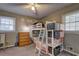 This bedroom features bunk beds, a dresser, and natural lighting from two windows at 2924 Vogue Dr, Douglasville, GA 30134