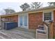 Cozy deck area featuring a seating bench with a cushioned seat and outdoor lights for evening enjoyment at 2924 Vogue Dr, Douglasville, GA 30134