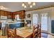 Cozy dining area adjacent to the kitchen, featuring a wooden table set for six and natural light at 2924 Vogue Dr, Douglasville, GA 30134