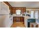 Well-lit kitchen with ample cabinetry and a view of the backyard through the adjacent patio doors at 2924 Vogue Dr, Douglasville, GA 30134