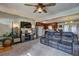 Inviting living room with a modern entertainment center and an open view into the adjacent kitchen at 2924 Vogue Dr, Douglasville, GA 30134