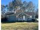 Charming single-story home with a cozy front porch and well-maintained lawn at 57 Haven Ridge Dr, Carrollton, GA 30116