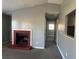 A living room features a brick fireplace at 57 Haven Ridge Dr, Carrollton, GA 30116