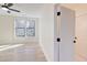 Bedroom featuring hardwood floors, large windows, and a ceiling fan at 1456 S Gordon Sw St, Atlanta, GA 30310