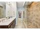 Primary bathroom features a double vanity, glass shower, and access to walk in closet at 327 Alderwood Ln, Atlanta, GA 30328