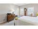 This bedroom is equipped with a dresser, lamp, and a grandfather clock at 327 Alderwood Ln, Atlanta, GA 30328