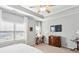 Bright bedroom with tray ceilings and sitting area with lots of natural light from large window at 327 Alderwood Ln, Atlanta, GA 30328