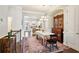 Bright dining room with hardwood floors connecting to the kitchen and living spaces at 327 Alderwood Ln, Atlanta, GA 30328