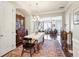 Open-concept dining room with a chandelier, hardwood floors, and views of the living room at 327 Alderwood Ln, Atlanta, GA 30328