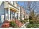 Beautiful townhome exterior with brick steps and lush landscaping along the sidewalk at 327 Alderwood Ln, Atlanta, GA 30328